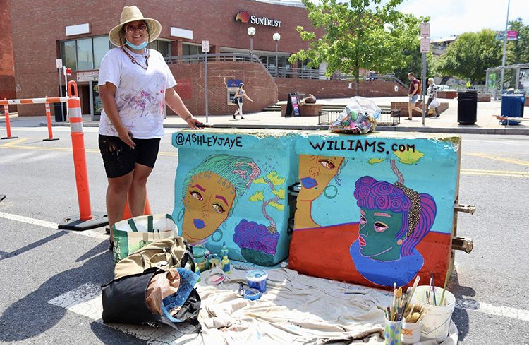 Ashley Jaye Williams by her Support Your Sister mural