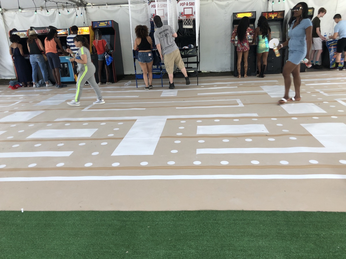 Vinyl floor tape Pac-Man installation for the Roots Picnic by Ashley Jaye Williams